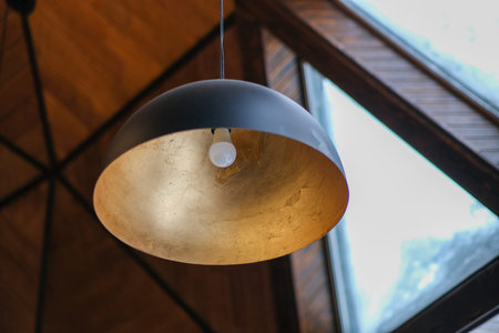Dome-type luminaire covered with golden paint on the inside