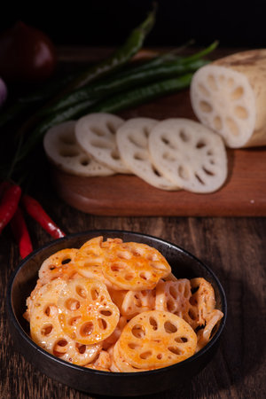 Korean food, lotus root and sweet chili on wooden backgroundの写真素材