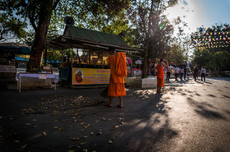 monk sweep at roadside taken in Thailand, Chiang Maiのeditorial素材