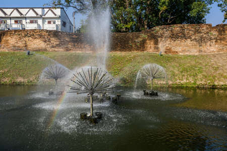 small fountain at riverの写真素材