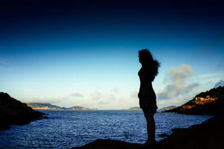 women standing at seaside の写真素材