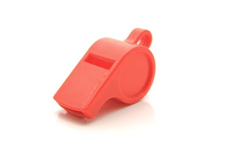 red plastic whistle toy isolatedの写真素材
