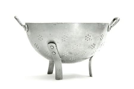 old vintage metallic sieve isolated backgroundの写真素材