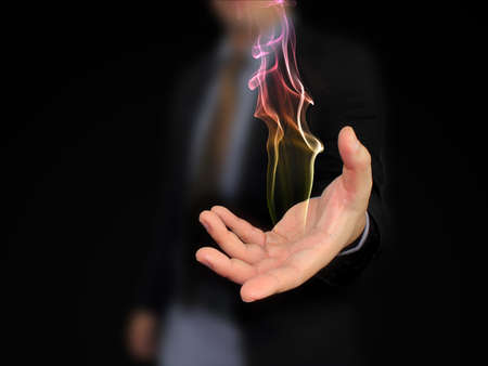 hand holding fireの写真素材