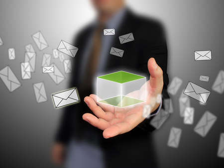 Businessman holding message boxの写真素材
