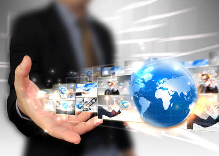 Businessman holding world .Technology concept の写真素材