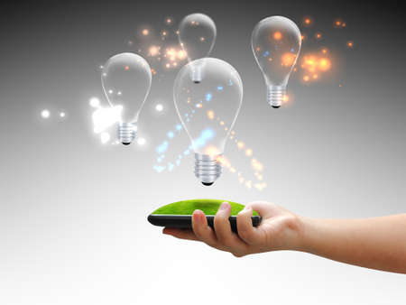 hand holding lightbulb : eco conceptの写真素材
