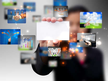Businesswoman holding a business cardの写真素材