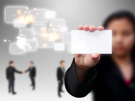 businesswoman holding a blank business cardの写真素材