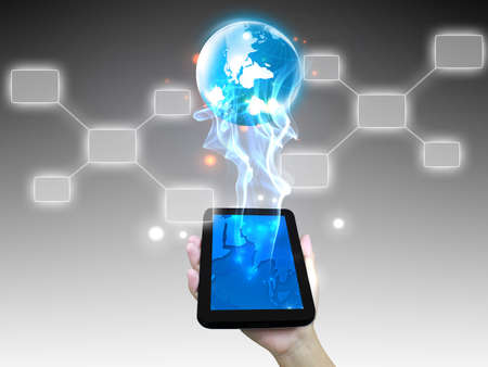 Businessman holding world with touchscreen の写真素材