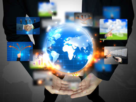 businessman holding business worldの写真素材