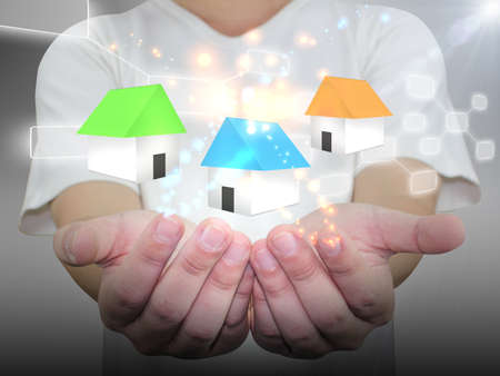 Hands holding houseの写真素材
