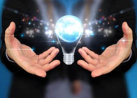 businessman holding Light bulb,concept get idea の写真素材