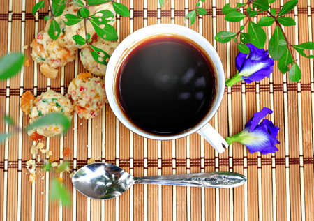 Espresso and cookies in garden の写真素材