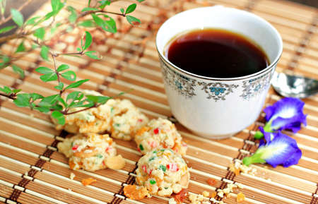 Espresso and cookies in gardenの写真素材