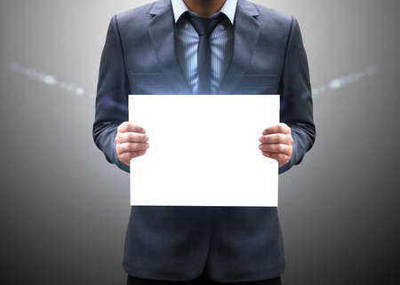 Businessman holding blank の写真素材