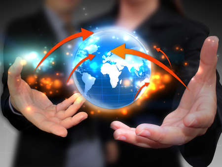 Business people holding business world の写真素材