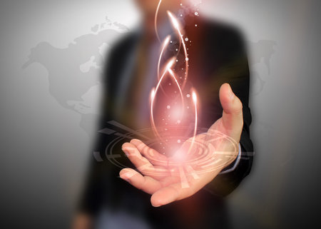 businessman holding glowing lights 