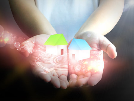 Hand holding house の写真素材