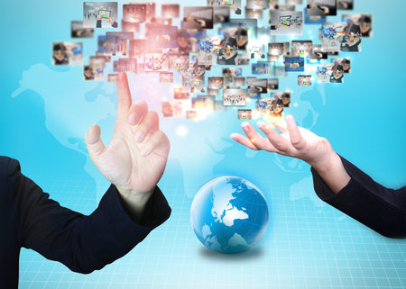 Business people holding business world