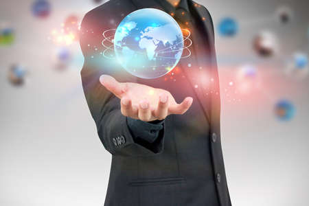 businessman holding worldの写真素材