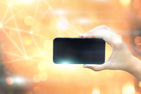 female hands holding smartphoneの写真素材