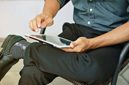 Businessman using digital tablet,hand touching screen on digital tabletの写真素材