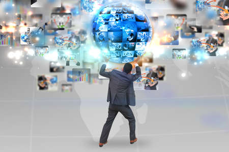 Businessman holding business world の写真素材