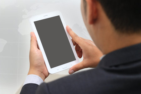 Businessman using digital tablet.