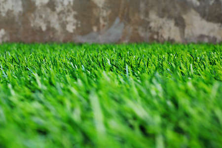 Green sports field with artificial grass の写真素材