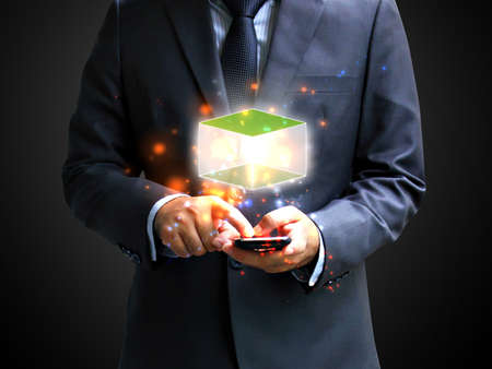 Businessman holding cubic.の写真素材