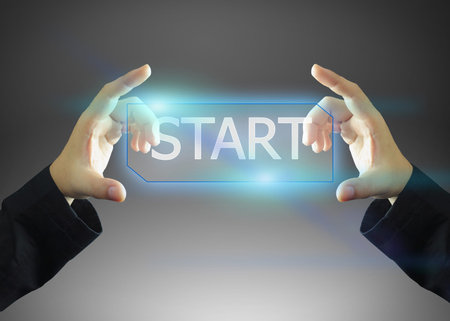 businessman holding on start button.