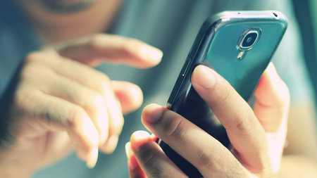 Businessman using using mobile smart phone.