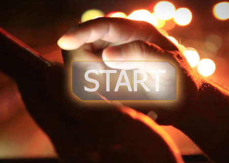 businessman pushing on start button.の写真素材