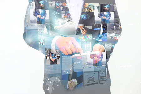 Businessman using digital tablet.double exposure of businessman.の写真素材