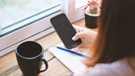 Young woman using mobile smart phone.の写真素材