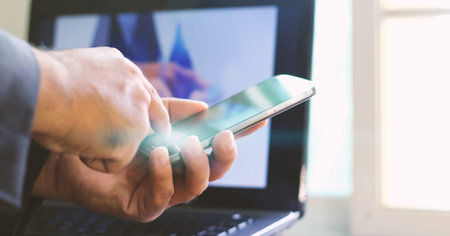 Businessman using mobile smart phone.soft focus