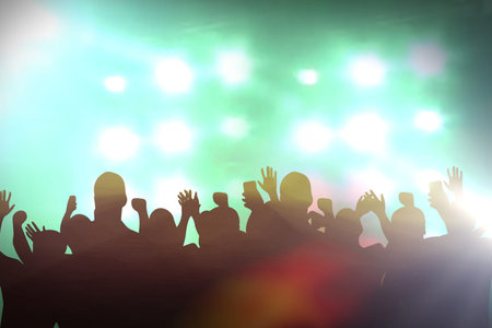Lights from the stage with people enjoying concert.