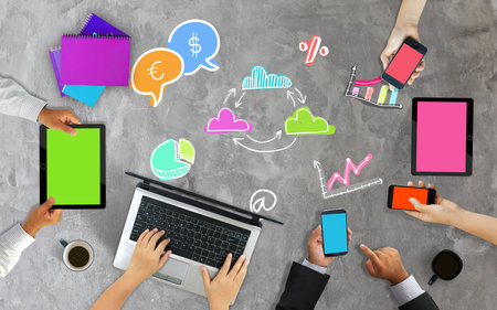 Business team working together,hands using smart phone. desk from aboveの写真素材