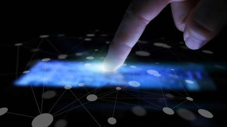 Hand touching network on screen.の写真素材