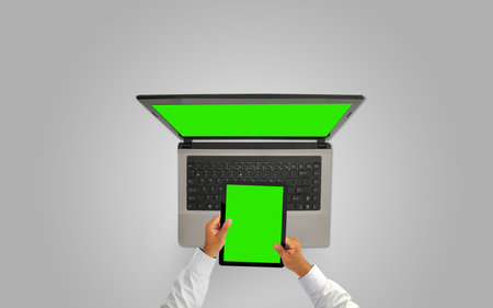 Businessman working with tablet and laptop,green screen