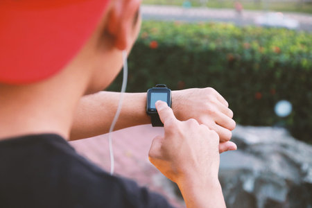 Man using smart watch in conjunction with the exercise.