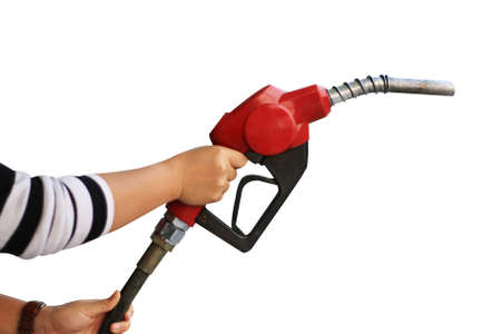 Hand holding fuel pump nozzle isolated on white backgroundの写真素材