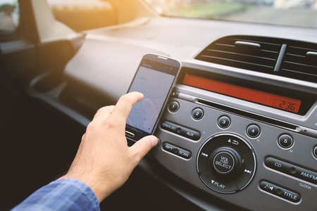 Man using map on smartphone.navigation in the car.gps on mobile