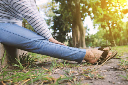 Young girl sitting in park. Relax time in the morningの写真素材
