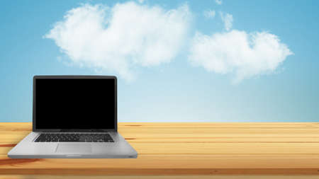 laptop with blank screen on the work table.の写真素材