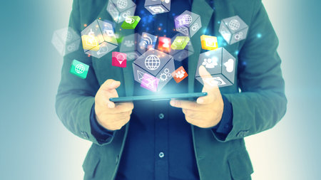 Businessman using digital tablet. Application icons interface on screen. Social media concept