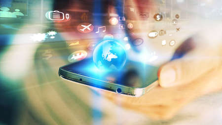 Businessman using mobile smartphone. Application icons interface on screen. Social media conceptの写真素材