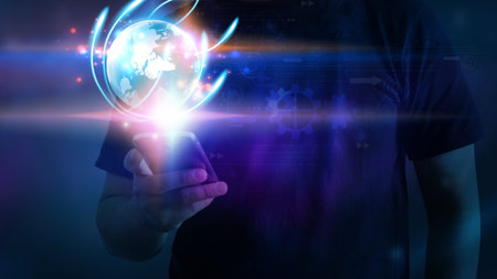 A man using smartphone with glowing globe. 