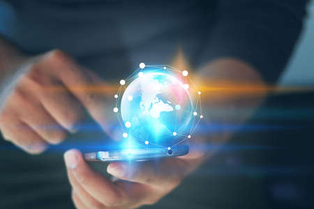 Businessman connected with the world of smart phones, Social network concept.の写真素材